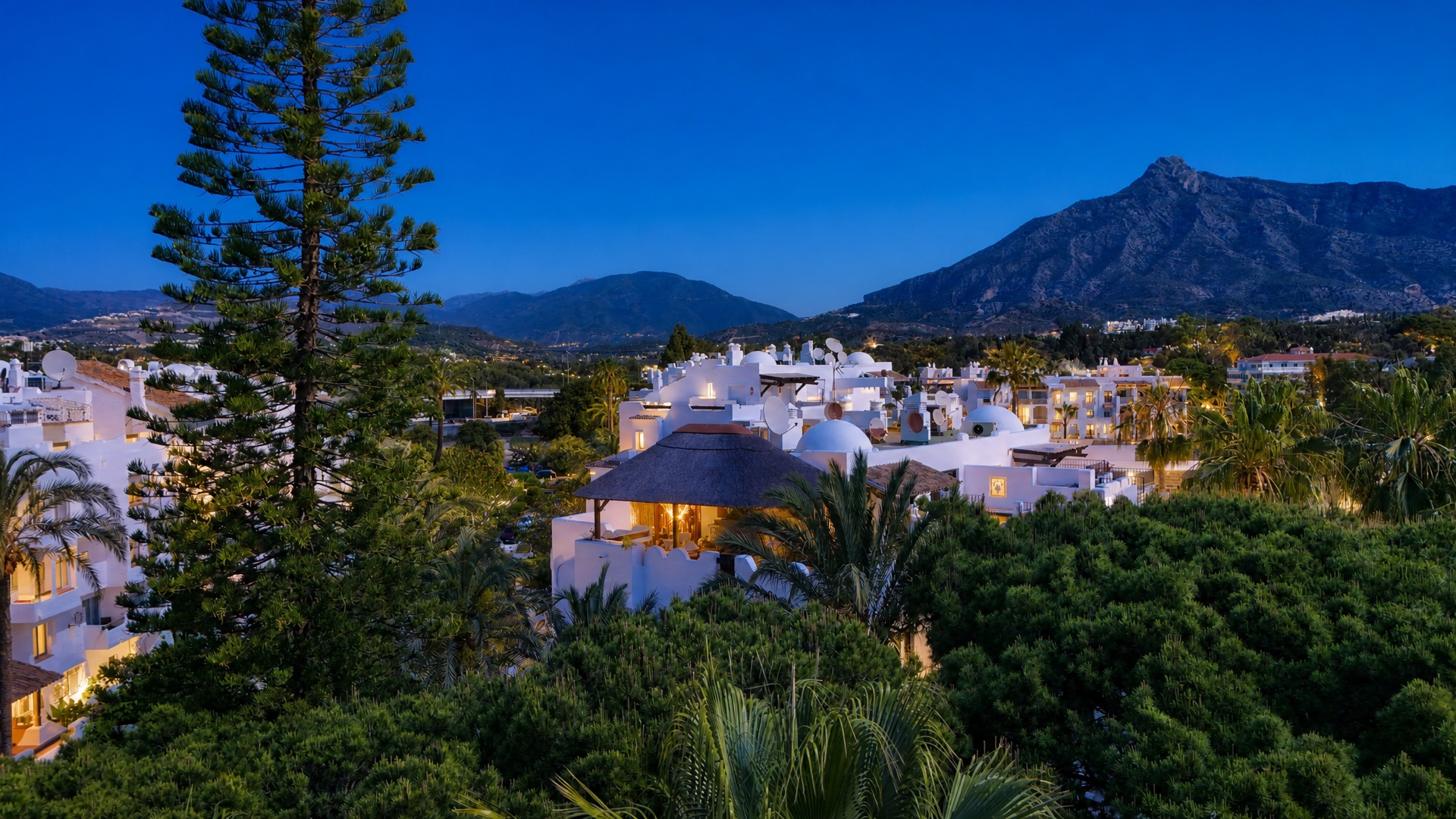 Dusk community view mountains at the La Isla penthouse