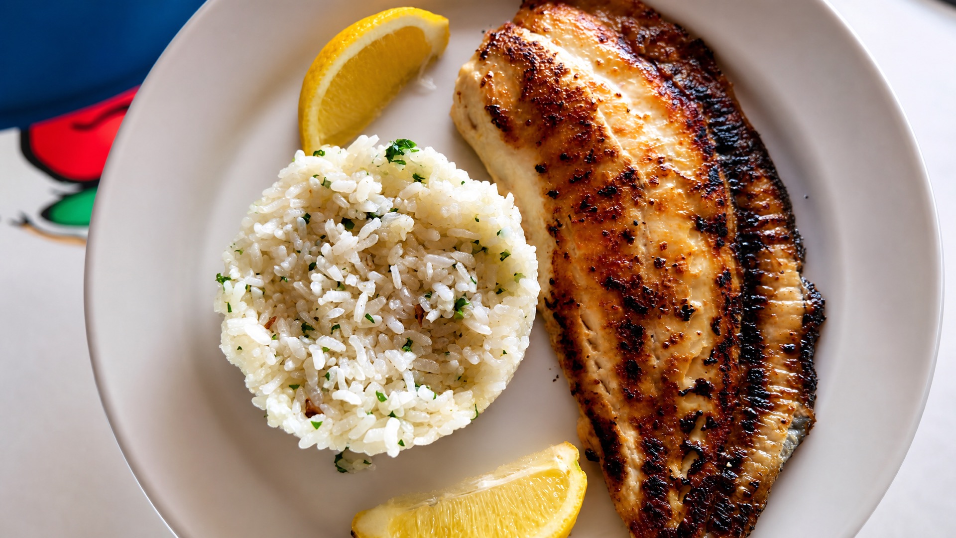 Grilled fish with rice at the owners' restaurant