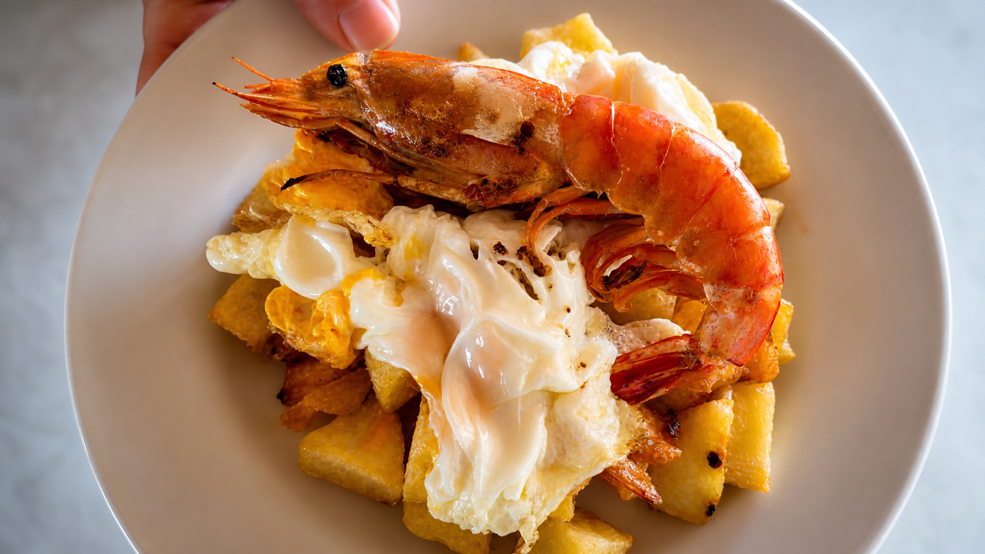 Prawns and egg over potatoes at the owners' restaurant