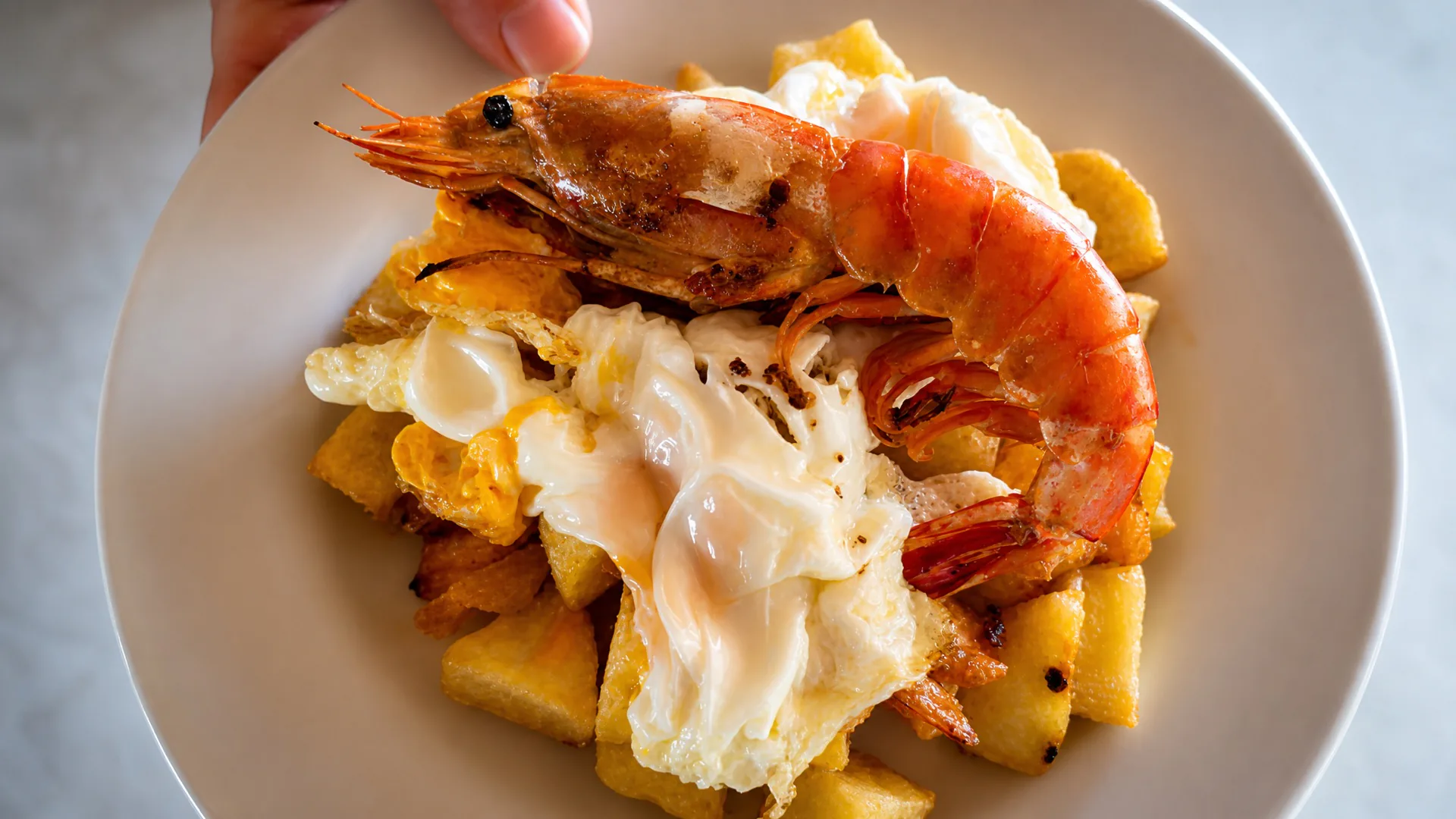 Prawns and egg over potatoes at the owners' restaurant