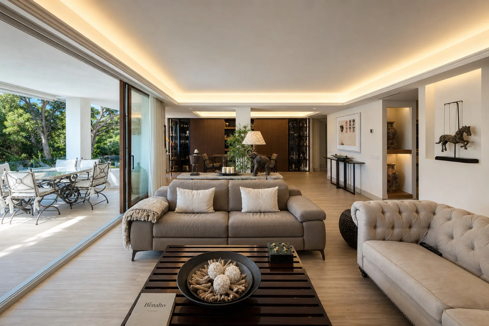 The open-plan living room opening to the terrace
