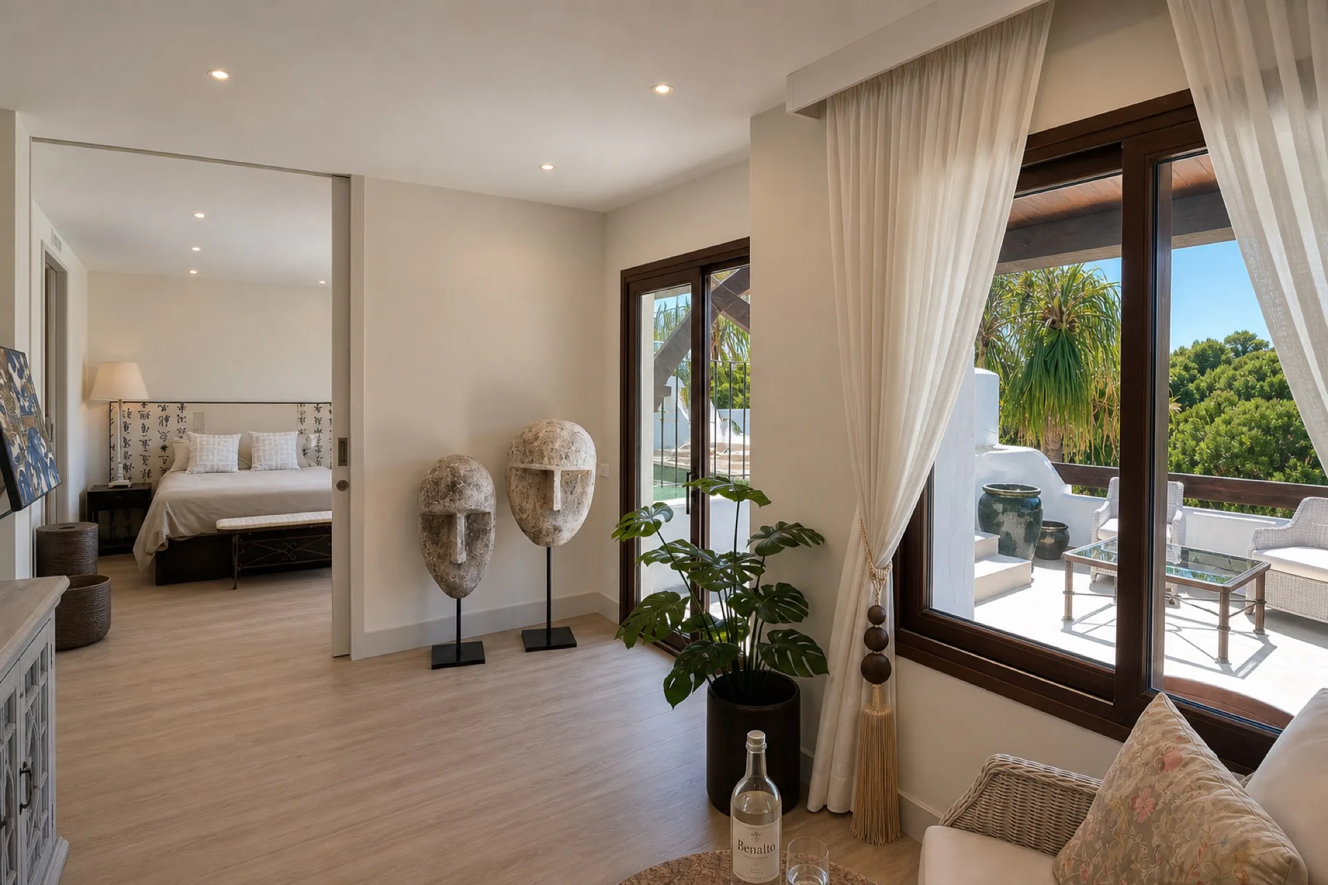 The master level sitting room, bedroom and terrace beyond