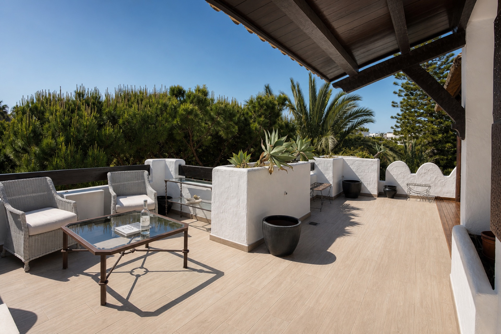 Sunny private terrace with seating at the La Isla penthouse
